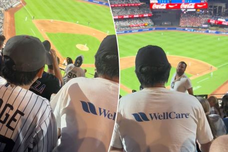 The young Yankees fan's dad screamed back at the fan who was yelling, 'Down in front.'