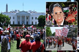 Pro-Palestinian activists from local and national organizations form a red line across the front of the White House on June 8, 2024 in Washington, DC.