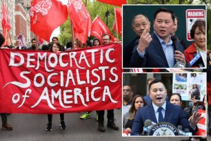 Members of the Democratic Socialists of America gather outside of a Trump owned building on May Day on May 01, 2019 in New York City