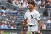 The Yankees' Luis Gil yells in celebration as he comes off the mound.