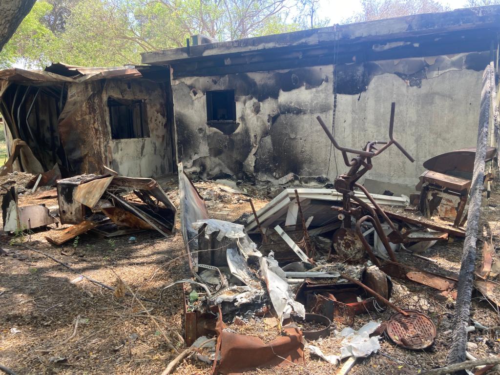 Charred remains of the Nir Oz kibbutz. .