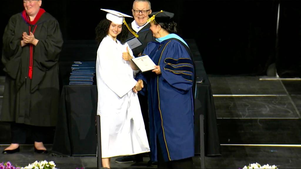 Paramus Catholic High School student receiving her diploma. 