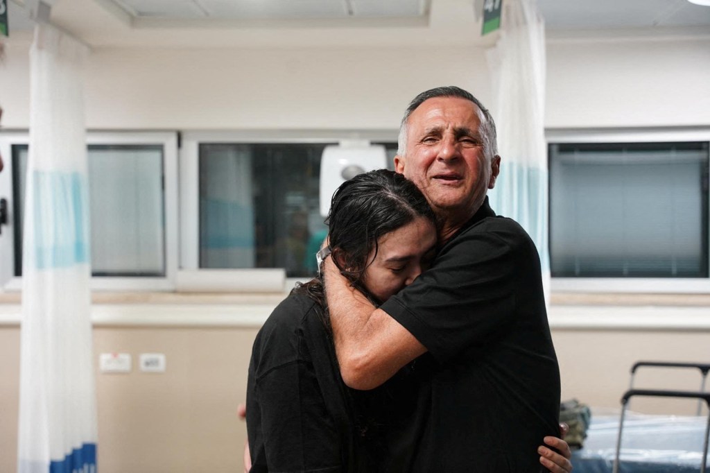 Noa Argamani, a rescued hostage embraces her father, Yakov Argamani, 