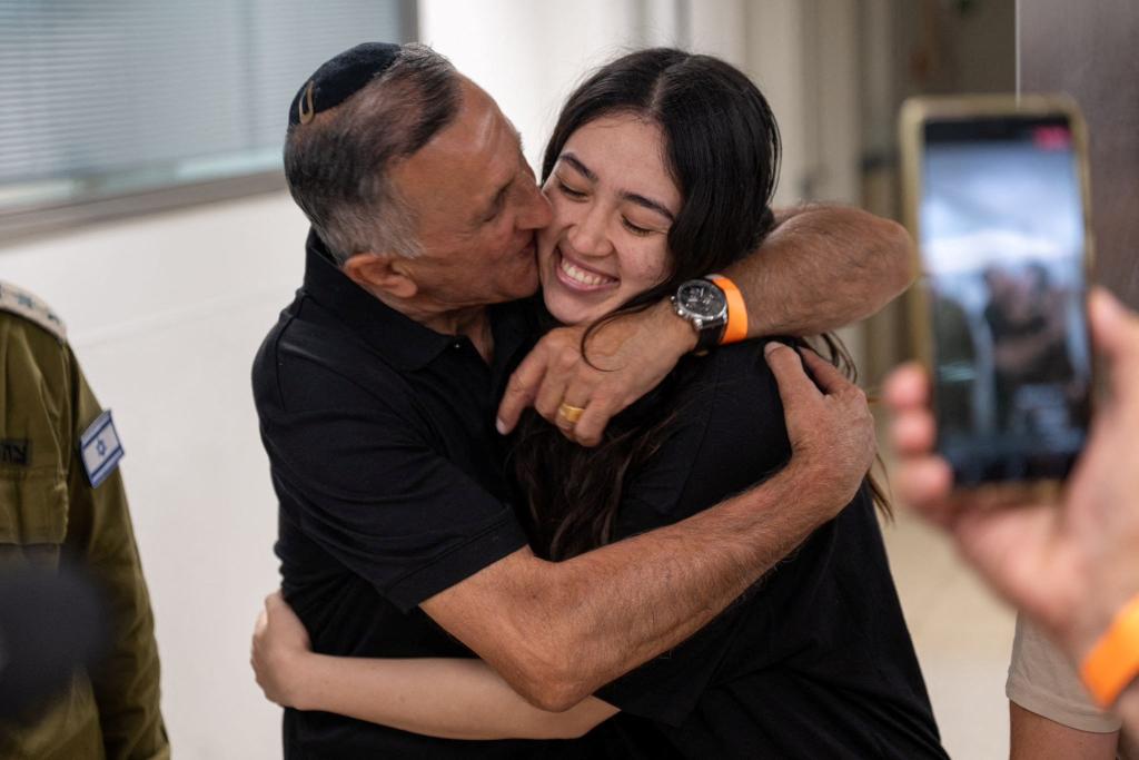 Rescued hostage Noa Argamani hugs her father after she was rescued from Hamas captivity on Saturday. 