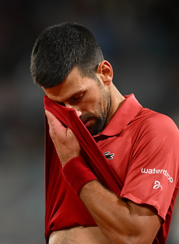 ovak Djokovic of Serbia reacts against Lorenzo Musetti of Italy in the Men's Singles third round match at Roland Garros during Day Seven of the 2024 French Open at Roland Garros on June 01, 2024