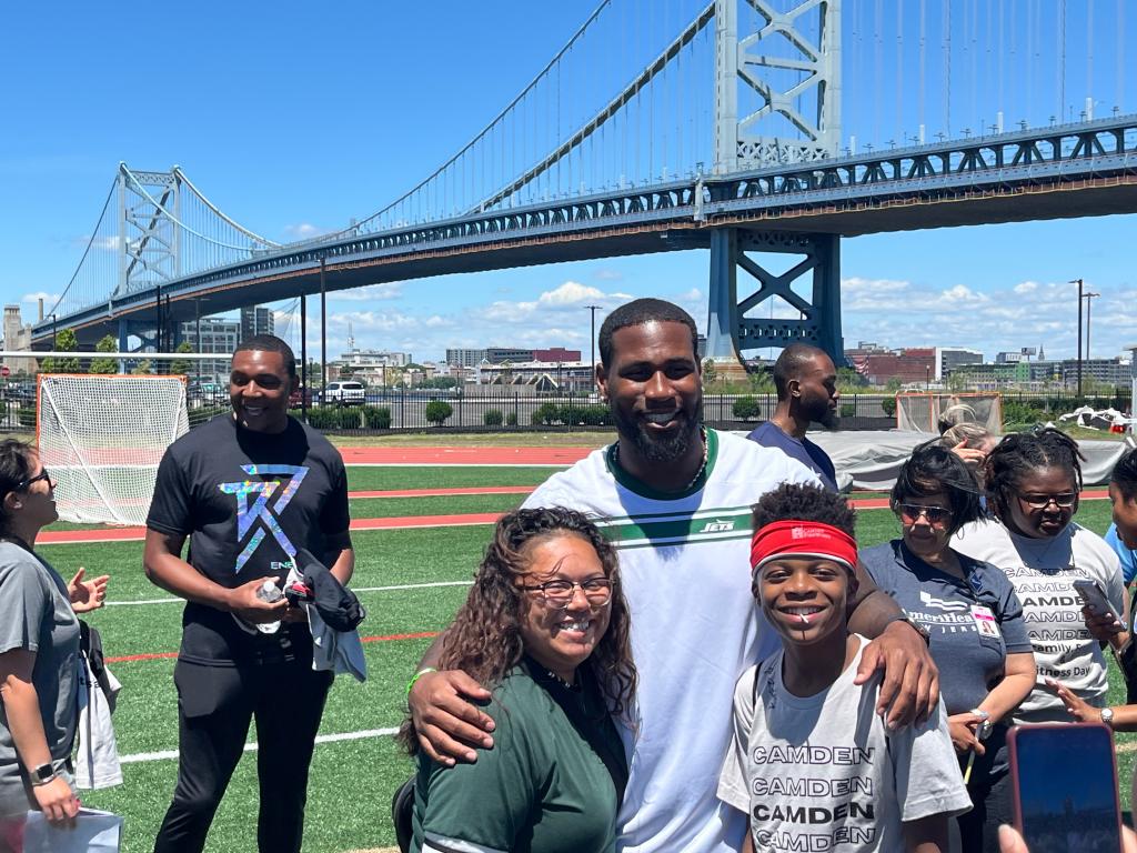 Offseason Jets acquisition Haason Reddick at Camden Fun Camp; Fitness Day wearing a Jets T-shirt. He has yet to report to offseason activities