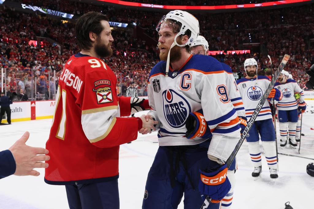 Ekman-Larsson shakes hands with Connor McDavid.