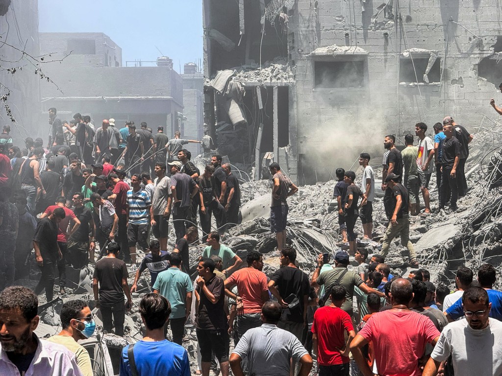 Palestinians following an Israeli strike in Gaza City on Saturday.