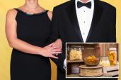 Couple in black tie evening wear with man holding an invitation