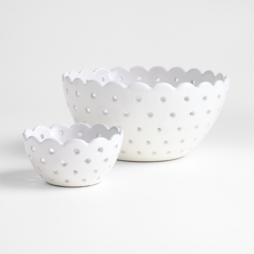 White Scallop Eyelet Stoneware Colanders by Laura Kim on a white surface