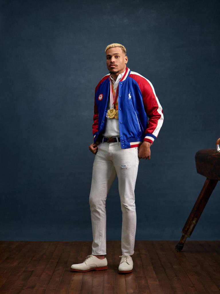 Paralympic gold and silver medalist Roderick Townsend standing in front of a horse, excited for custom Ralph Lauren Olympics gear for adaptive athletes