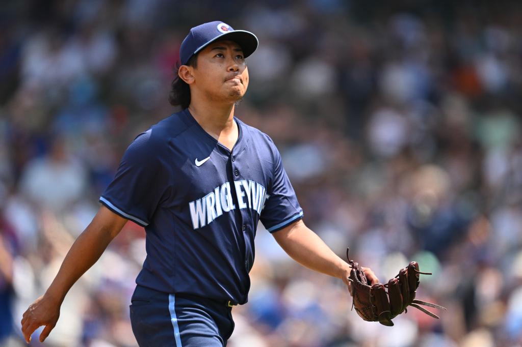 Shota Imanaga #18 of the Chicago Cubs walks to the dugout after being pulled in the fourth inning against the New York Mets at Wrigley Field on June 21, 2024.