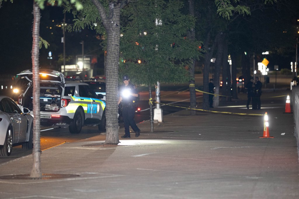 Police are seen at the scene of an assault on 34 st. between 11th And 12th Aves. in Manhattan, Monday, June 10, 2024. 