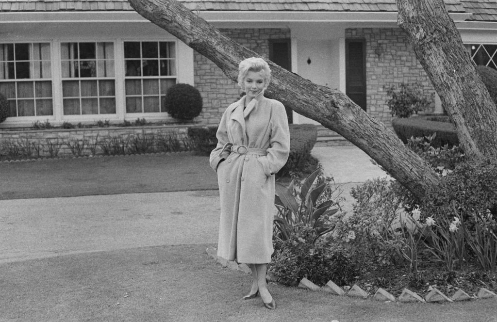 Marilyn Monroe posing outside her California home in 1956