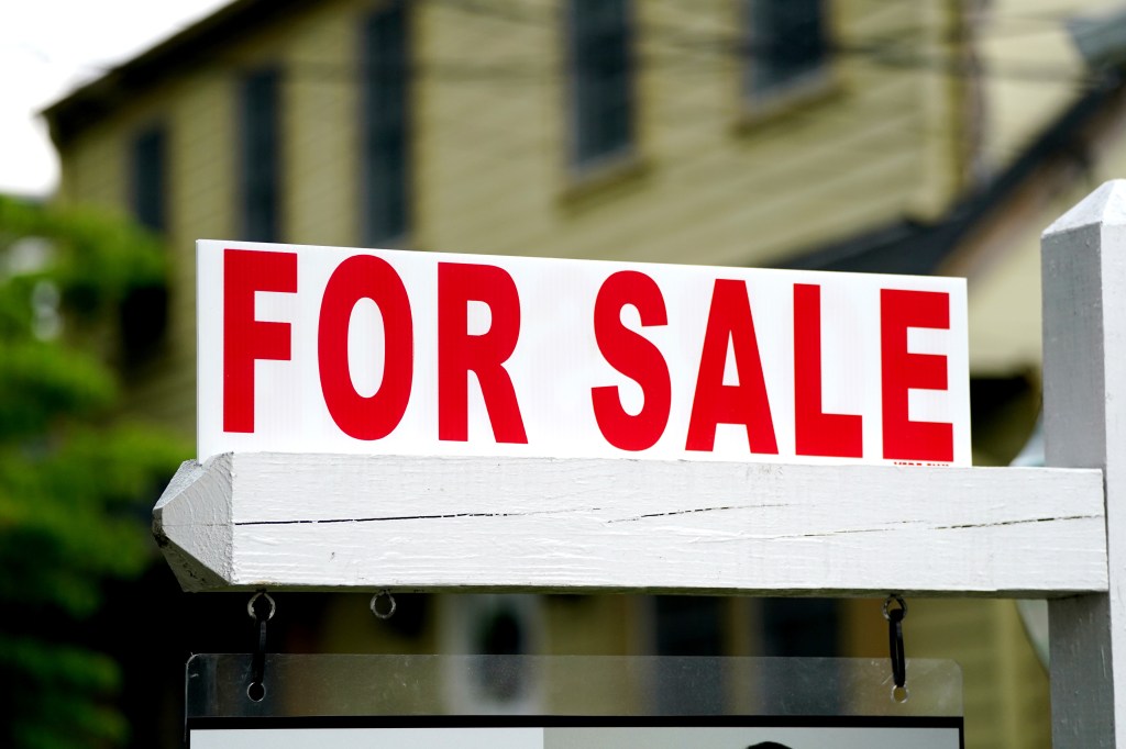 House for sale sign displayed in Hawthorne, NJ in June 2024