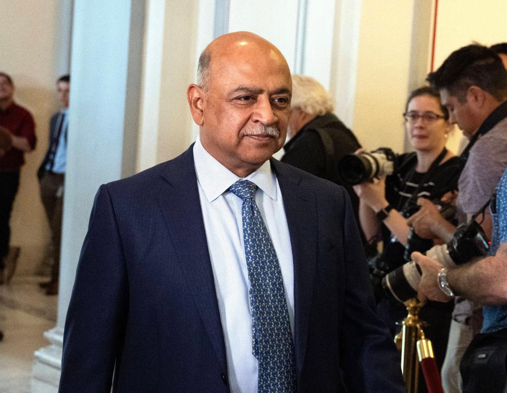 Arvind Krishna, CEO of IBM, arriving at the United States Senate Bipartisan Artificial Intelligence Forum in a suit and tie