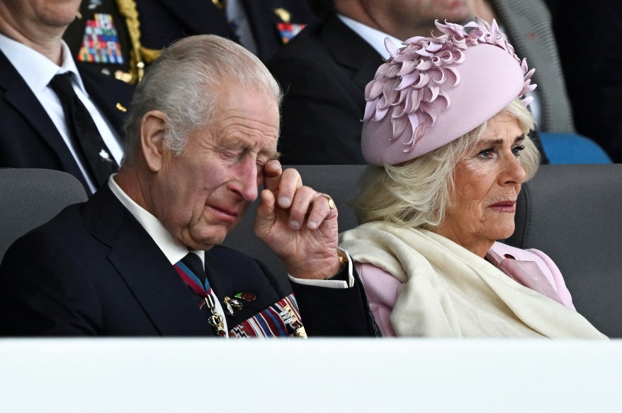 Britain's King Charles and Queen Camilla react as they attend a commemorative event for the 80th anniversary of D-Day, in Portsmouth, Britain June 5, 2024.
