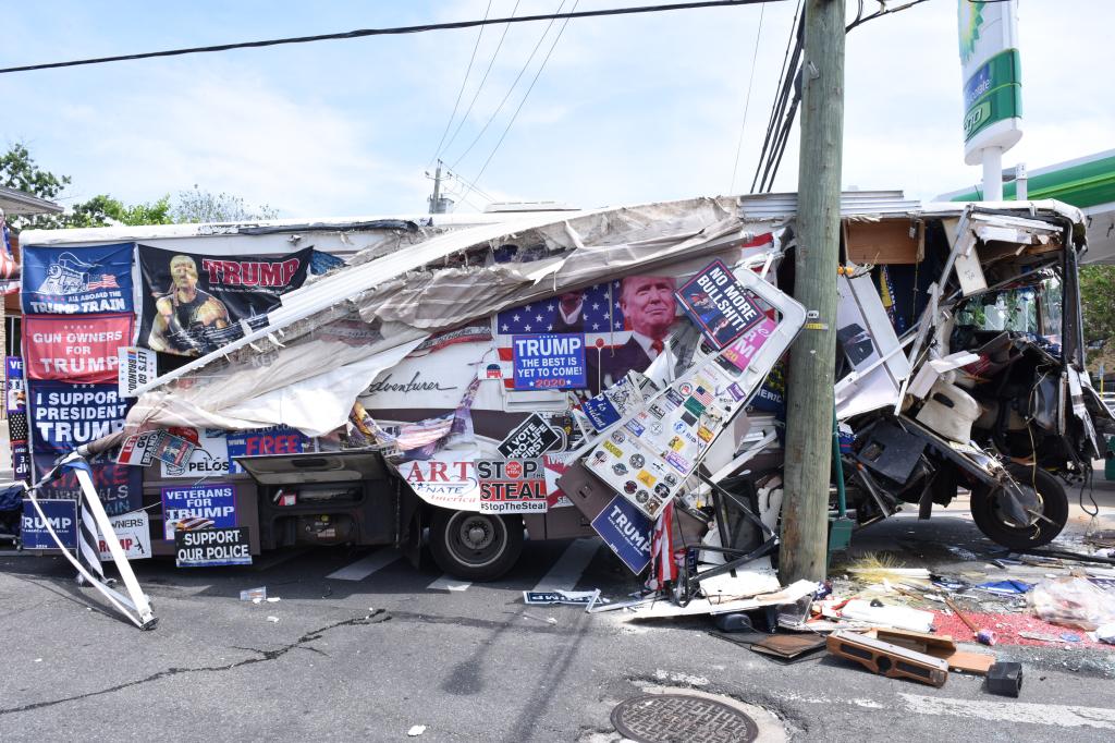 The left side of the vehicle was left a wreck with many of its posters torn off.