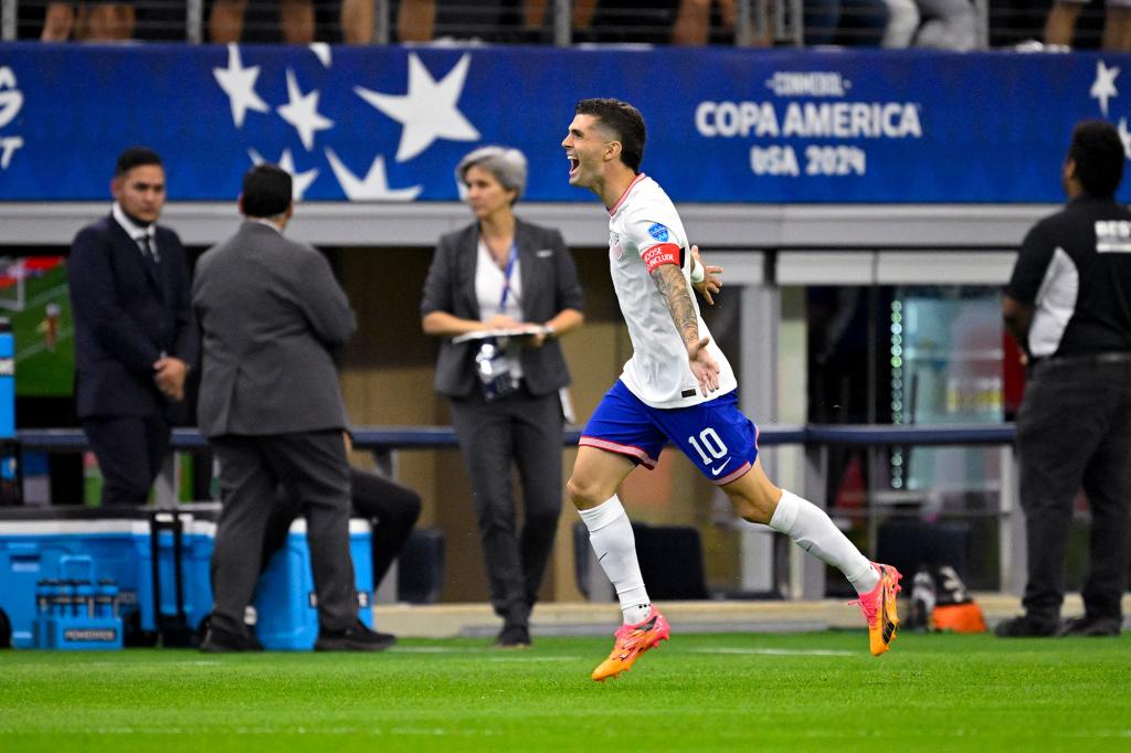 Christian Pulisic celebrates after scoring a goal for the USMNT against Bolivia.