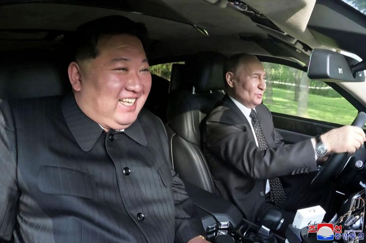 Russia's President Vladimir Putin, right, drives a car with North Korean leader Kim Jong Un sitting in front passenger seat at a garden of the Kumsusan State Guest House in Pyongyang, North Korea Wednesday, June 19, 2024. 