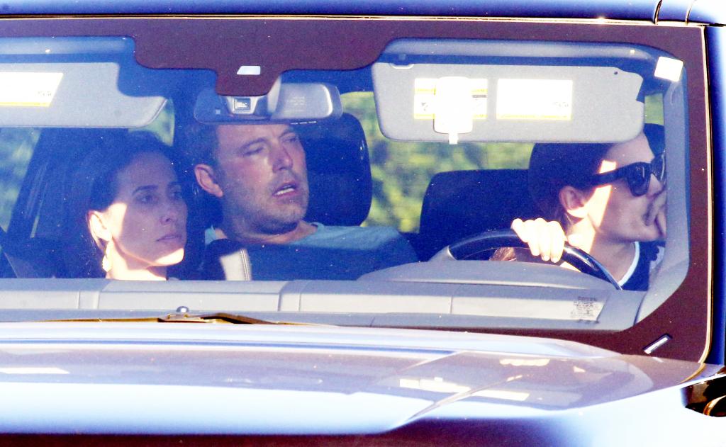 Jennifer Garner ordering food from a fast food drive through while a sweaty Affleck sits in the back seat.