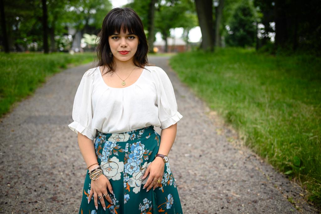 Becky Oliveira on a sidewalk