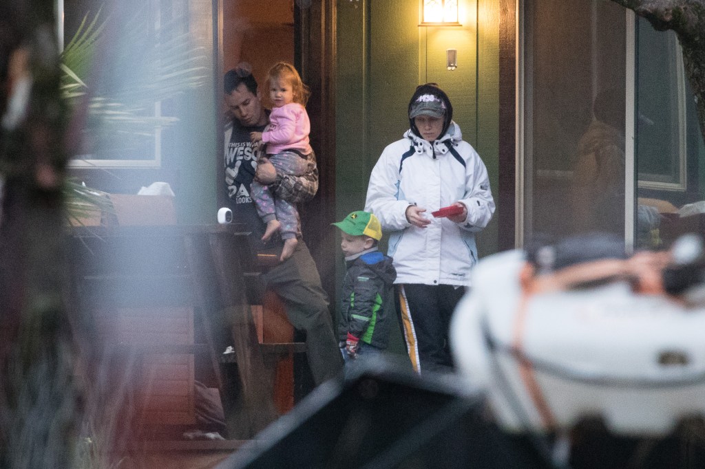 Sherri Papini and her husband Keith Papini with their children Tyler and Violet outside their home in Redding.