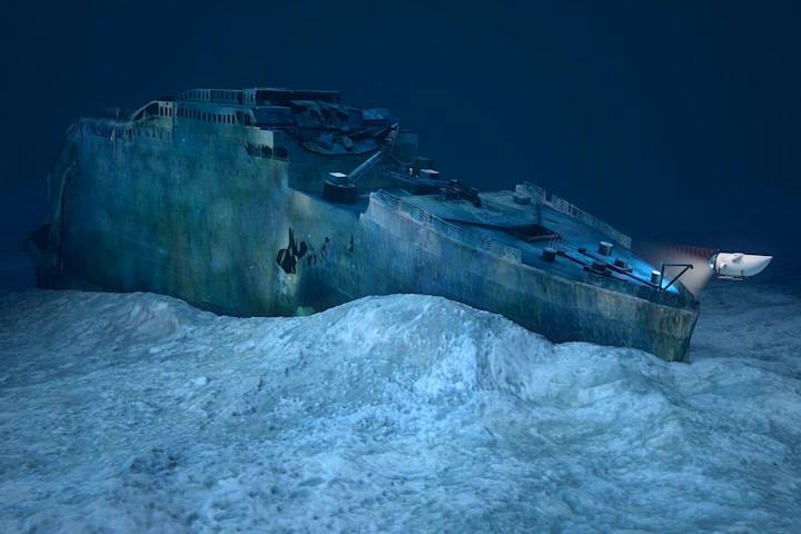 Digital rendering of the OceanGate submersible near the Titanic wreckage, with a debris field indicated at a distance of 1600 feet