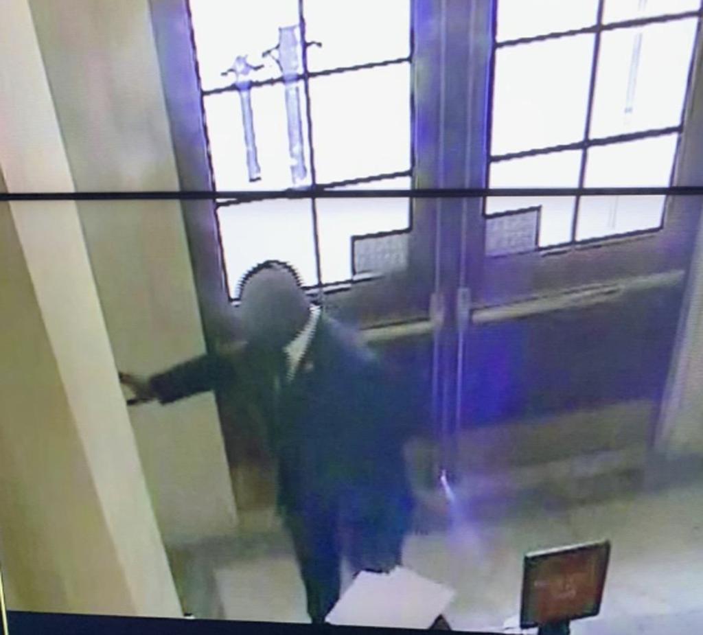 Security camera footage of Bowman pulling the fire alarm.