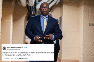 Rep. Jamaal Bowman, D-N.Y., in a suit, holding a phone in the U.S. Capitol before being censured by the House on December 7, 2023.