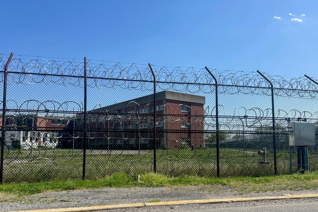Rikers Island jail complex in the Bronx borough of New York, behind a fence with barbed wire on May 7, 2024.