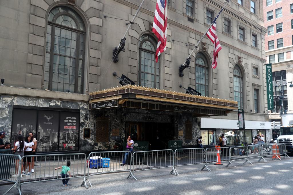 The Roosevelt Hotel in New York City at Vanderbilt Avenue and 45th Street in Manhattan, with flags displayed, absence of parked motorbikes/e-bikes.