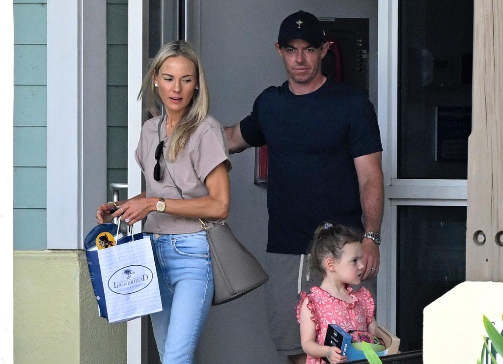 Rory McIlroy and wife Erica Stoll with daughter Poppy at the Loggerhead Marinelife Center on Monday.