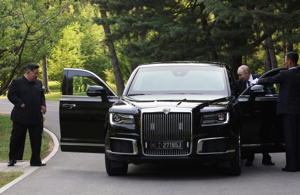 Russia's President Vladimir Putin and North Korea's leader Kim Jong Un leave an Aurus car after a ride in Pyongyang, North Korea June 19, 2024.