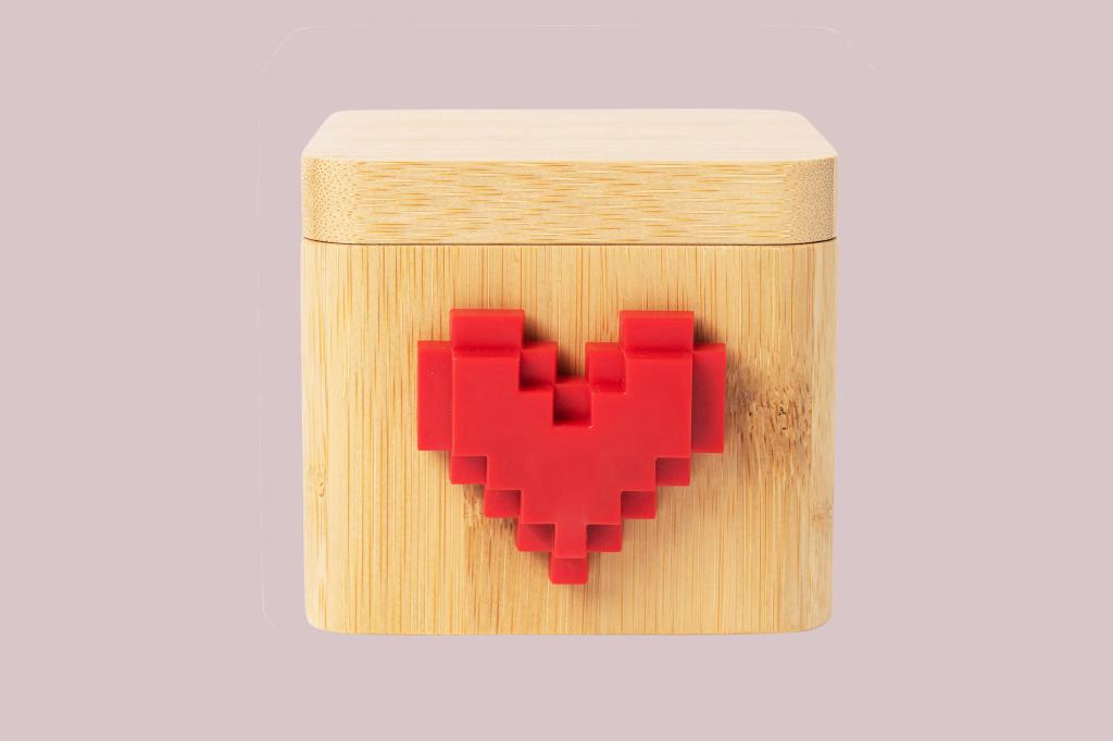A wooden box with a heart on it