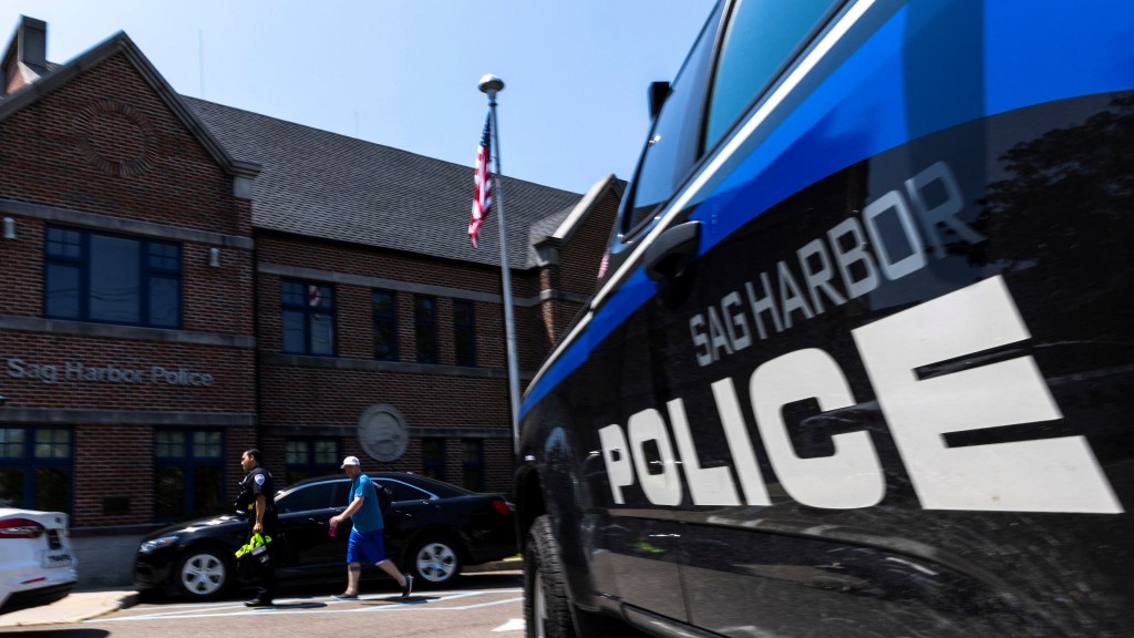 A Sag Harbor police officer arrives to the headquarter on the day Timberlake was arrested.