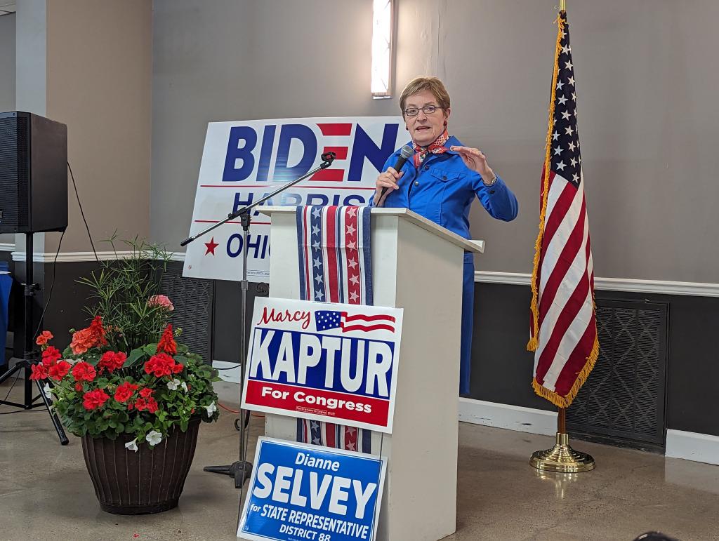 Congresswoman Marcy Kaptur standing at a podium with a microphone, addressing guests at the Sandusky County Democratic Party Spring Dinner