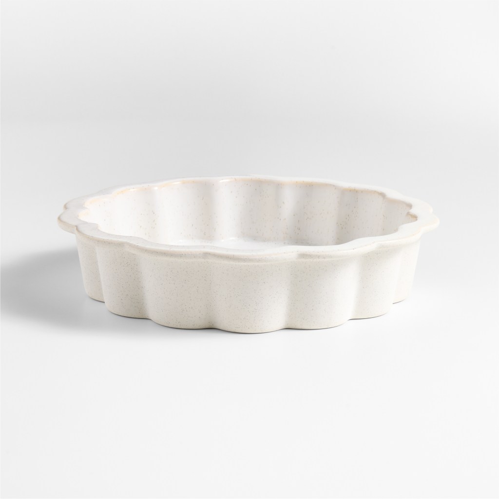 A white ceramic scalloped pie dish by Laura Kim for Crate and Barrel
