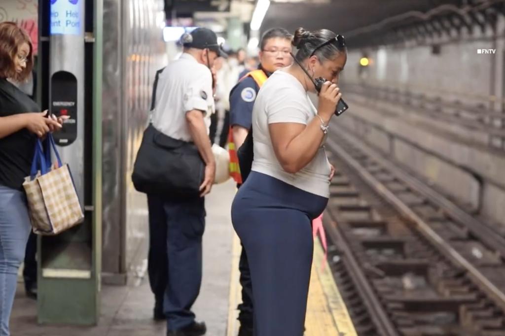 Authorities inspect the tracks by where a man was accidentally pushed onto the subway rails on Thursday.