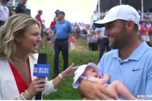 Scottie Scheffler hold son Bennet during an interview with CBS's Amanda Balionis after winning the Travelers championship on Sunday.