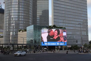 A screen displays a picture of Noa Argamani who was kidnapped during the deadly October 7 attack