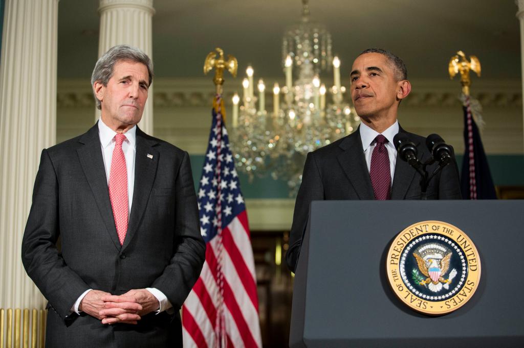 Secretary of State John Kerry looks on as U.S. President Barack Obama makes a statement after meeting with his National Security Council at the State Department, February 25, 2016 in Washington, DC.