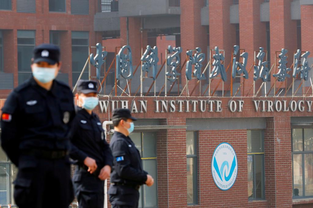 Security personnel keep watch outside the Wuhan Institute of Virology during the visit by the World Health Organization (WHO) team tasked with investigating the origins of the coronavirus disease (COVID-19), in Wuhan, Hubei province, China February 3, 2021.