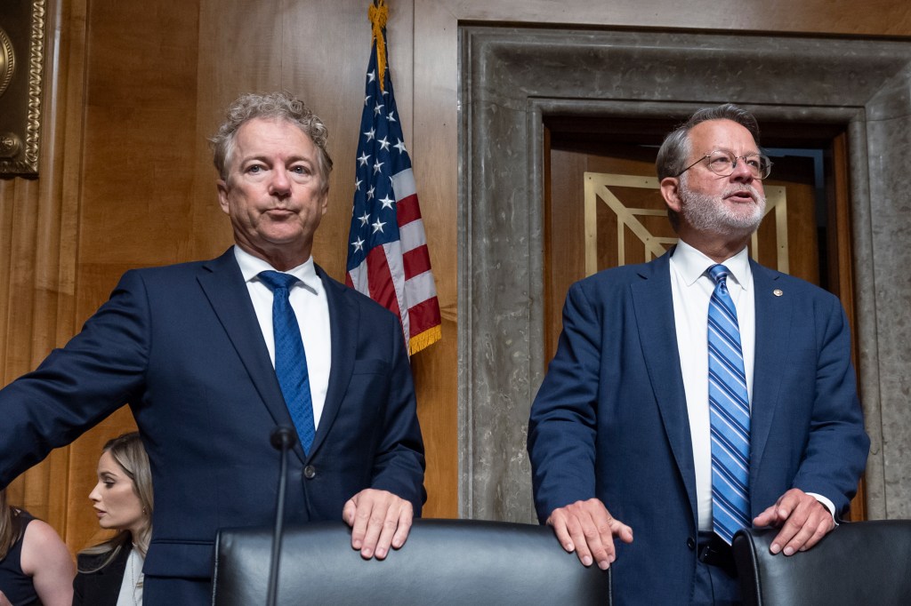 Sen. Rand Paul, R-Ky., left, the ranking member of the Senate Homeland Security and Governmental Affairs Committee, joins Chairman Gary Peters, D-Mich., for a hearing to examine origins of COVID-19, at the Capitol in Washington, Tuesday, June 18, 2024.