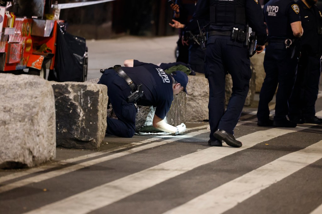 police officer at shooting scene in Midtown