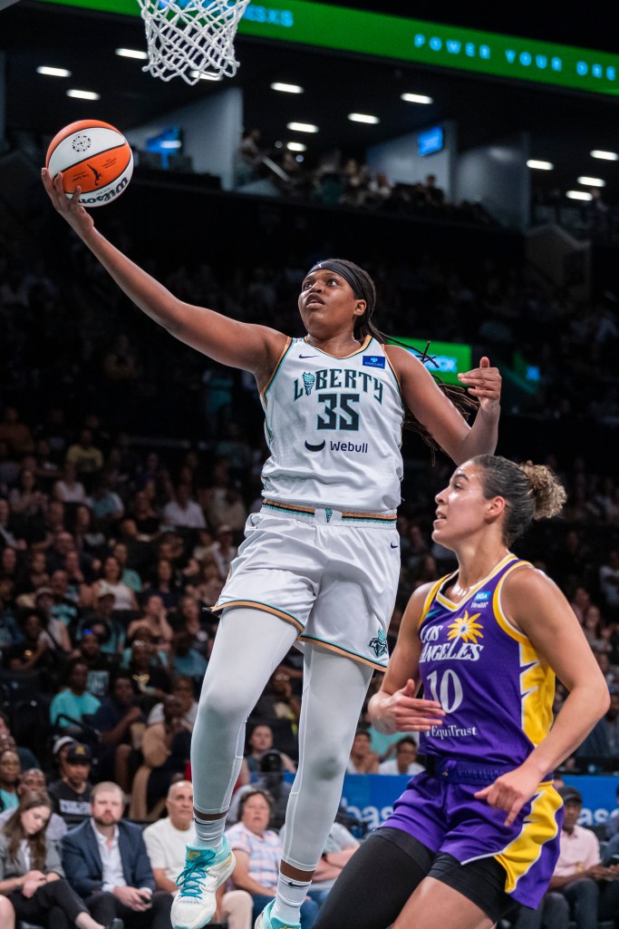 Liberty forward Jonquel Jones (35) shoots a lay up over Los Angeles Sparks guard Kia Nurse (10)  in the first half against the Los Angeles Sparks at Barclays Center.