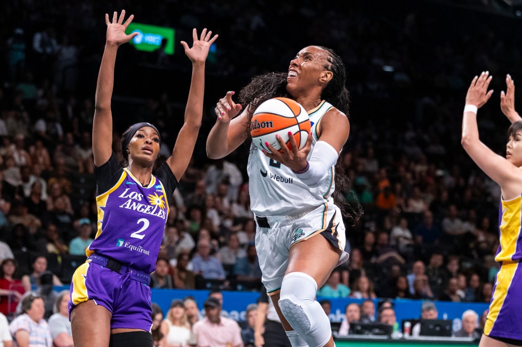 Liberty forward Kayla Thornton (5) shoots past Los Angeles Sparks forward Rickea Jackson (2) in the first half at Barclays Center.