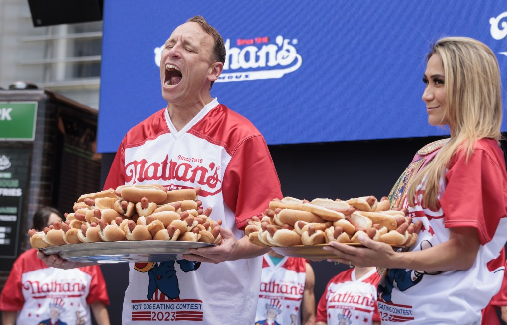 Top-ranked competitive eaters Joey Chestnut (L) and Miki Sudo (R) pose with plates of hot dogs during a weigh-in ceremony for Nathan's Famous Fourth of July International Hot Dog Eating Contest in New York, New York, USA, 03 July 2023.