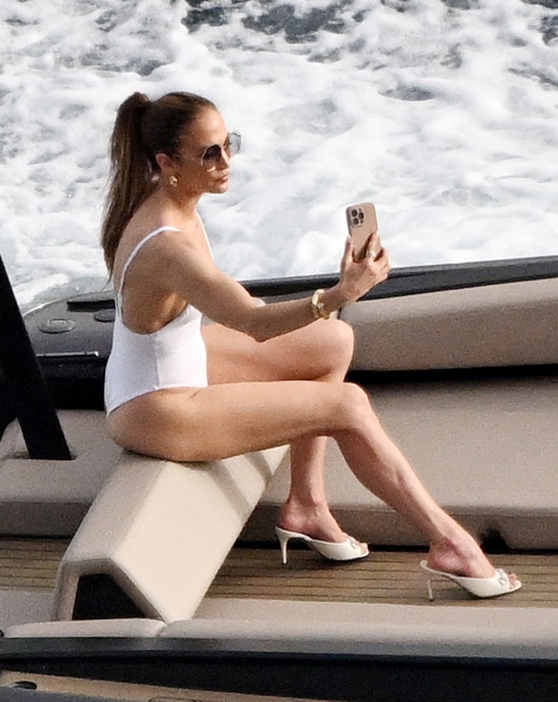 J-Lo on a boat with her phone. 