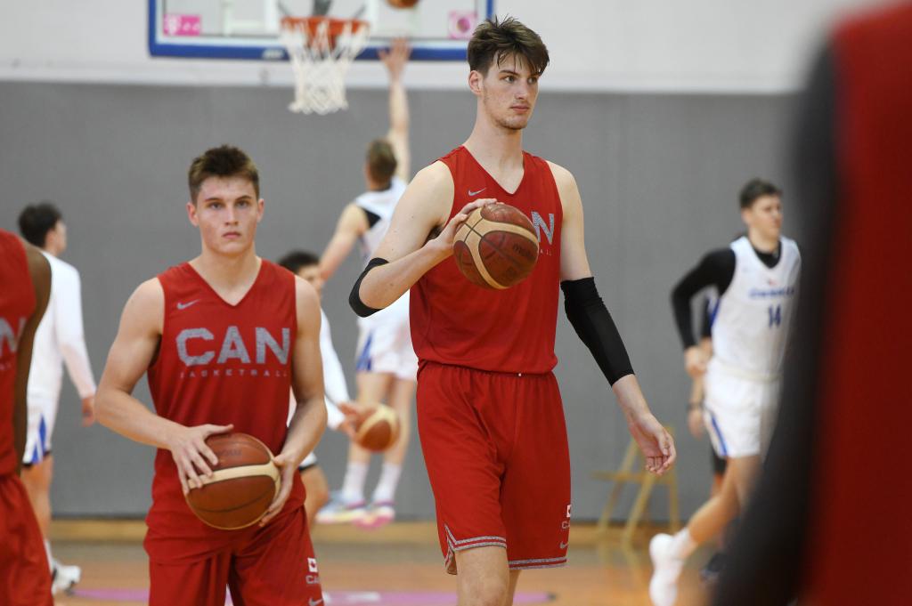 17-year-old Canadian basketball player Olivier Rioux, the tallest teenager in the world, participating in a tournament